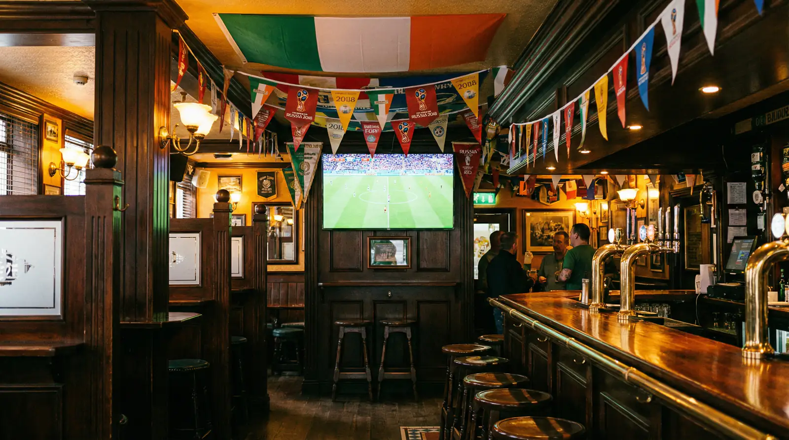 Ireland may not be at the 2026 World Cup, but the tournament is still ours. Irish players abroad, adopted teams, late-night pub culture, and how to enjoy it.